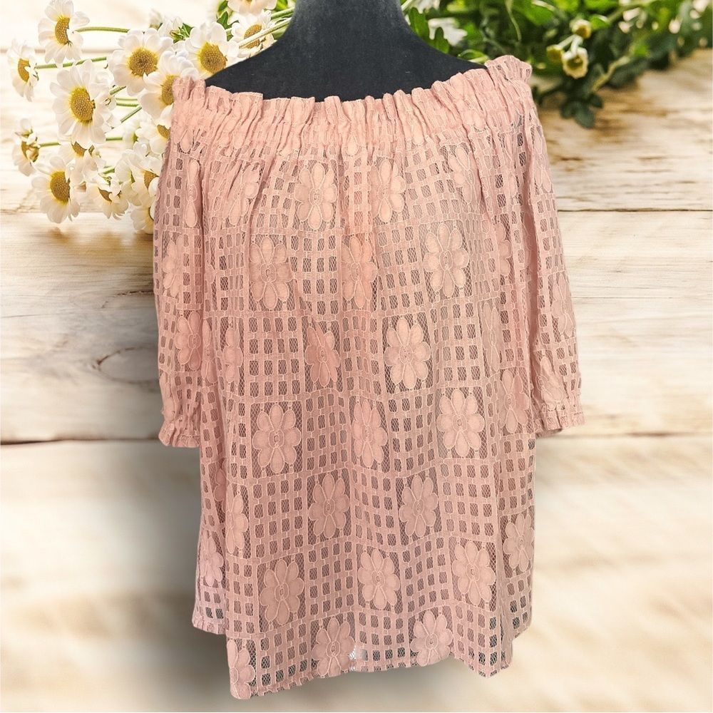 Lace off the shoulder blouse. Puffy lace sleeves. Floral, sheer. Lined body.